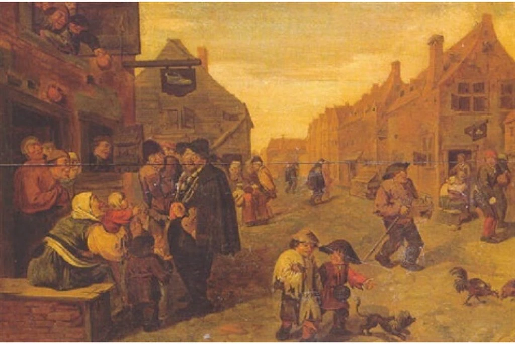 Una strada di villaggio con un suonatore di ghironda